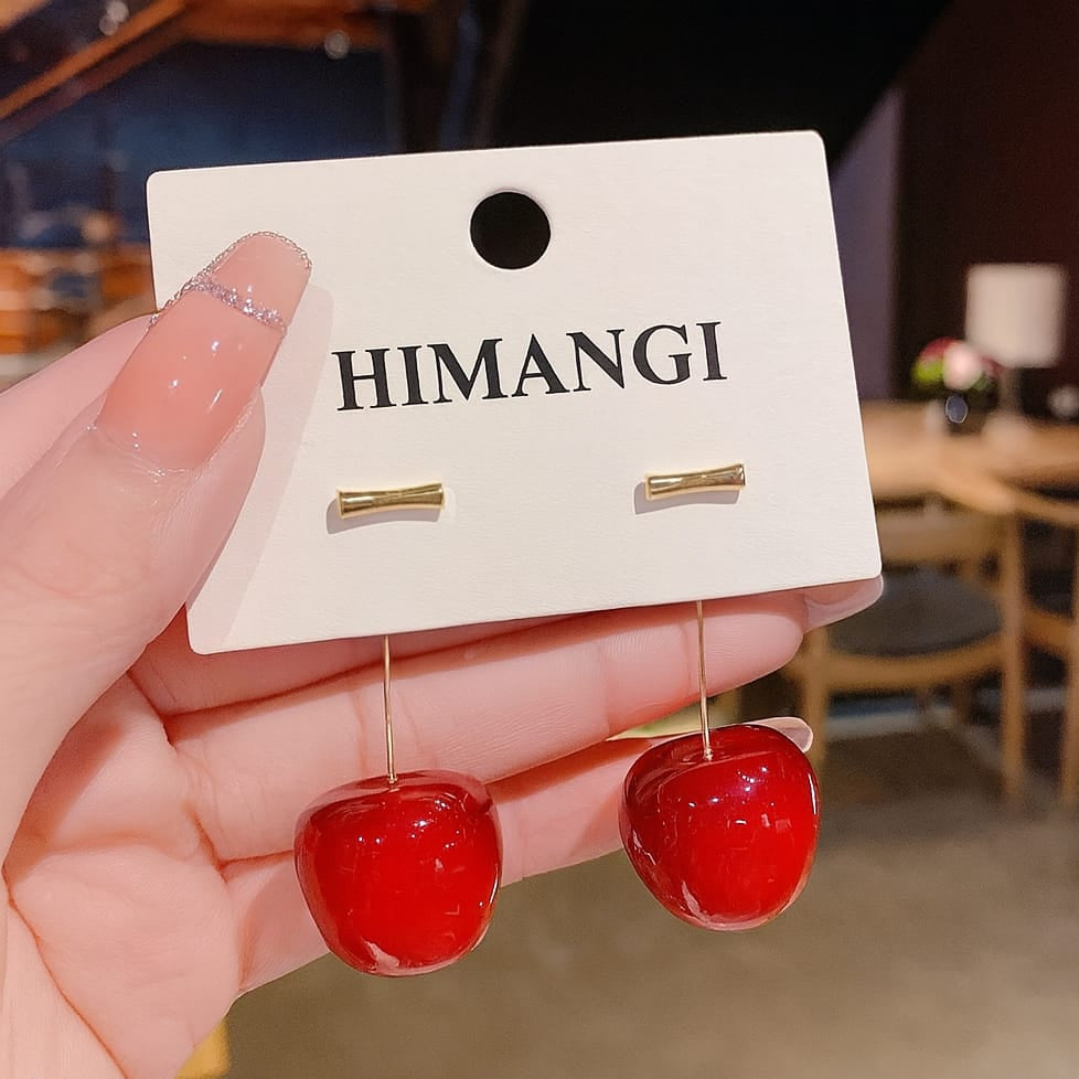 Cherry Drop Earrings on a 'HIMANGI' branded card held by a hand.